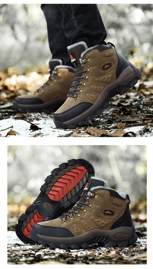 Pair of brown hiking boots with red sole on a natural background