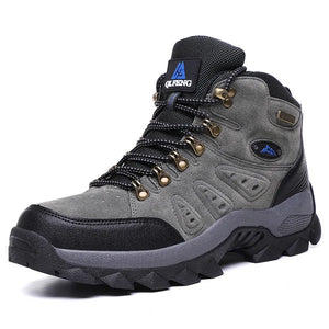 Gray hiking boot with black accents on a white background