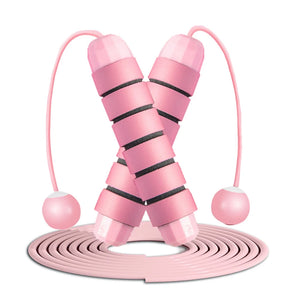 Pink skipping rope with pink handles on a white background