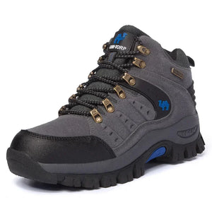 Gray hiking boot with black sole on a white background