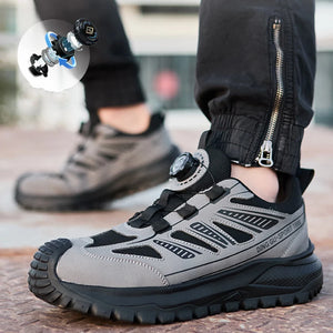 Gray and black safety work shoe with a close-up of the sole on a blurred background.