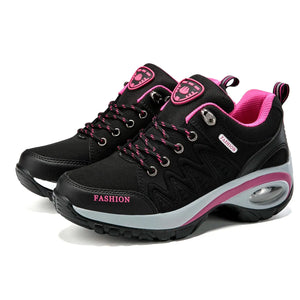 Black and pink sneakers with 'Fashion' text on a white background