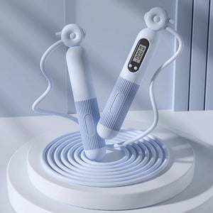 White jump rope with digital display on a light gray background
