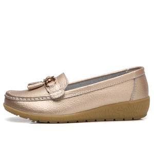 Women's leather loafers with metal tassel detail, round toe, and rubber sole