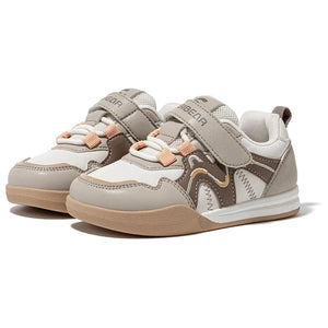 A pair of children's sneakers in beige, white, and brown with peach-colored laces and gold accents, shown on a white background.