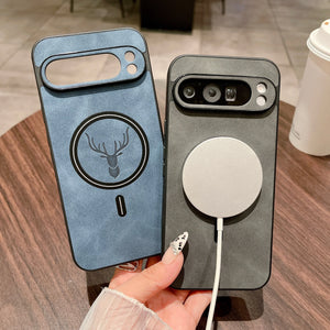 Two Leather Magnetic Cases for Pixel, one blue with a deer design and one gray with a magnetic charging pad, on a wooden surface.
