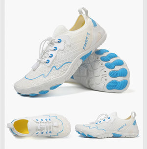 White athletic shoes with blue accents on a white background