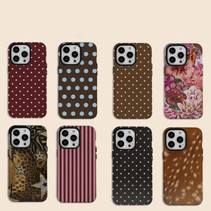 Collection of patterned Luxury INS Polka Dot Double Layer iPhone Case on a beige background with 'Clmj' branding.