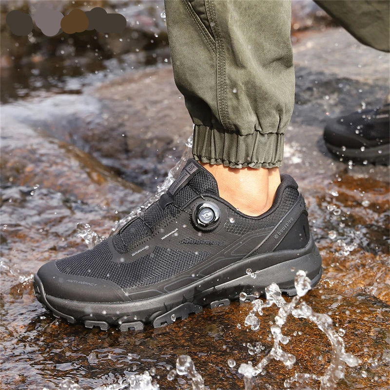 Person wearing black hiking shoes with a water splash, featuring the brand 'baasploa'.