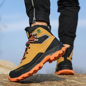 safety boots with orange soles on a blurred natural background