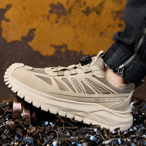 Beige safety work shoe sneaker with brand logo on a textured background