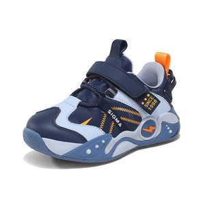 A children's athletic sneaker in navy blue, light blue, and white, featuring a hook-and-loop strap closure, a pull tab, and orange accents.