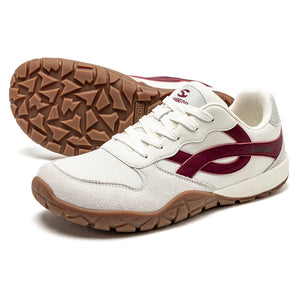 White sneaker with maroon accents and brown sole on a white background