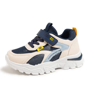 Children's sneaker with navy and beige design on a white background