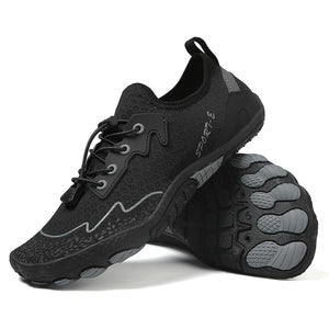 Black athletic shoe with gray sole on a white background