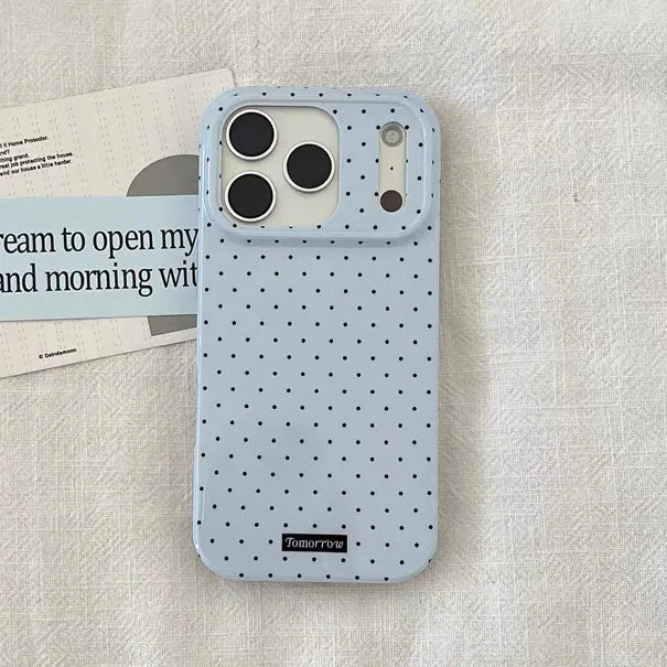 iPhone case with polka dot pattern on a textured surface