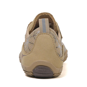 Tan shoe with gray accents on a white background