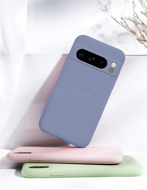 Three phone cases in blue, pink, and green on a white background