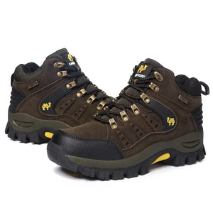 Pair of brown hiking boots with black soles on a white background