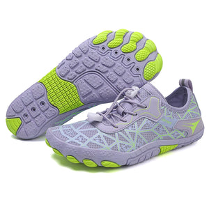 Pair of purple and green athletic shoes on a white background