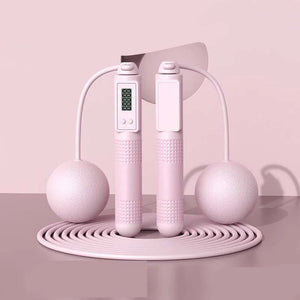 Pink jump rope with digital display on a pink background, labeled 'Dual purpose' and 'Pink'.