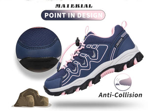 A navy blue and pink hiking shoe with white and black accents, shown on a white background with marketing text and feature callouts including 'MATERIAL POINT IN DESIGN' and 'Anti-Collision'. A circular inset shows a close-up of the shoe's textured navy upper.