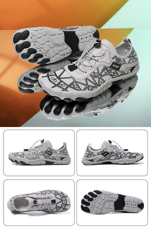 White athletic shoes with black sole design on a reflective surface with an orange and gray background.