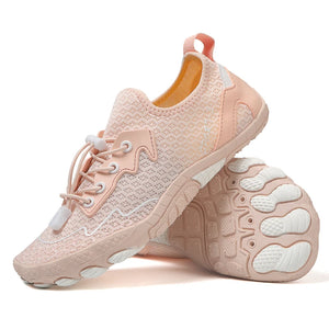 Pink sneaker with white sole on a white background