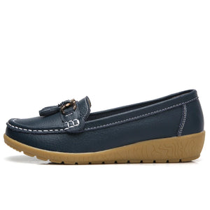 Women's leather loafers with metal tassel detail, round toe, and rubber sole