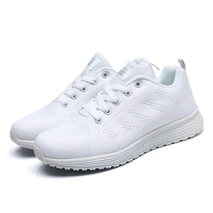 White running shoes on a white background