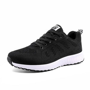 Black running shoe with white sole on a white background