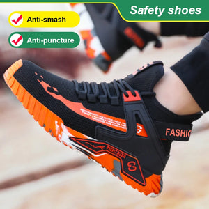 Black and orange safety shoe with anti-smash and anti-puncture features on a blurred background.