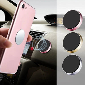 Pink phone holder with car mount and additional holders on a car dashboard.