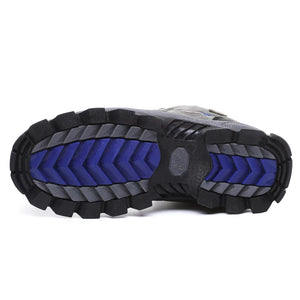 Close-up of a hiking boot sole with blue and black tread pattern on a white background