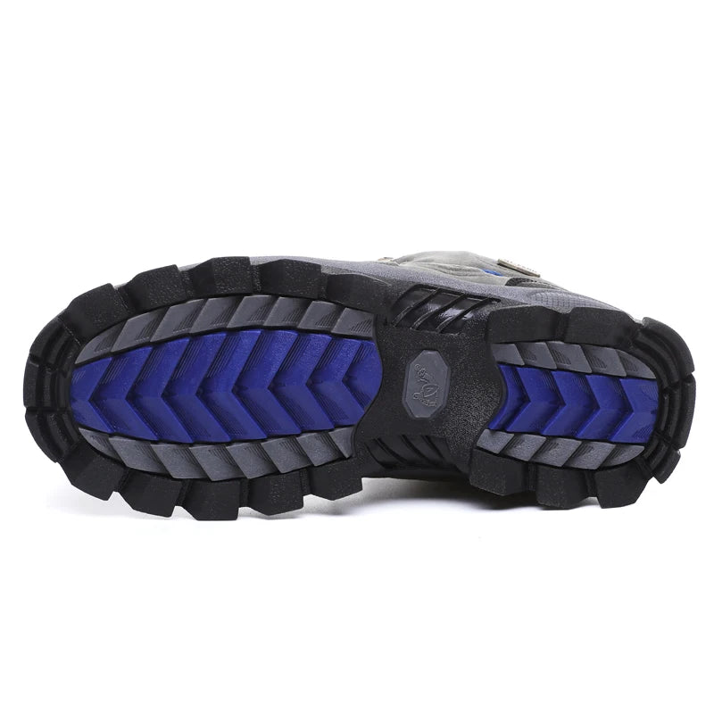Close-up of a hiking boot sole with blue and black tread pattern on a white background