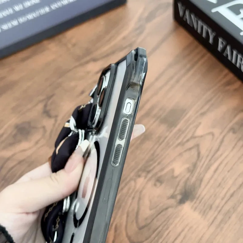 Person holding a iphone case with multiple compartments on a wooden surface