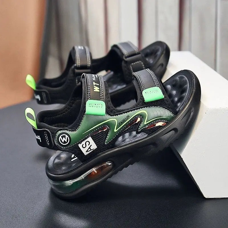 Black and green sandals with visible branding on a dark surface.
