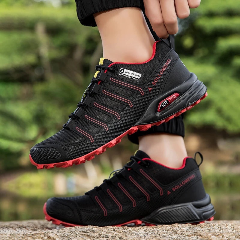 Black and red athletic shoes with visible brand logo on a blurred natural background