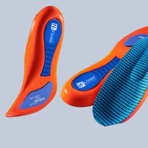 Orange and blue shoe insoles on a light gray background