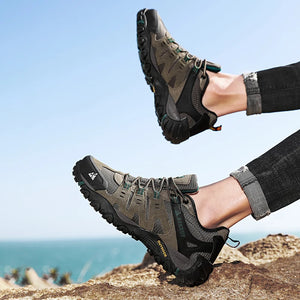 Person wearing hiking shoes with a scenic background