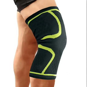 Black and green knee brace on a person's leg with 'Green' text at the bottom.