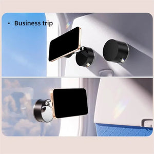 Phone holder attached to a car's interior surface with 'Business trip' text overlay.
