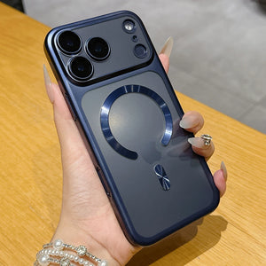 Phone case with a ring holder held by a hand on a wooden surface