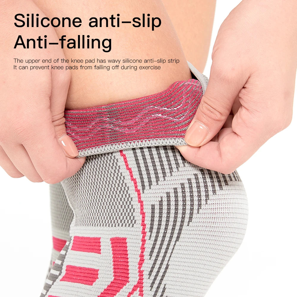 Knee pad with silicone anti-slip strip being held by a person, on a white background.