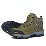 A pair of outdoor hiking boots in olive green with black and gray soles, shown on a white background.