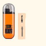 Orange nose hair trimmer with charging cable, cleaning brush, and packaging on a beige background