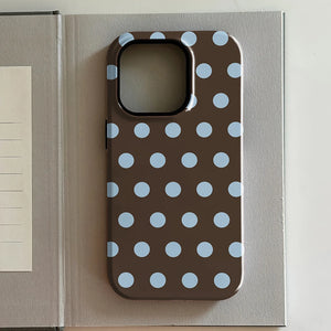 iPhone case with blue polka dots on a brown background