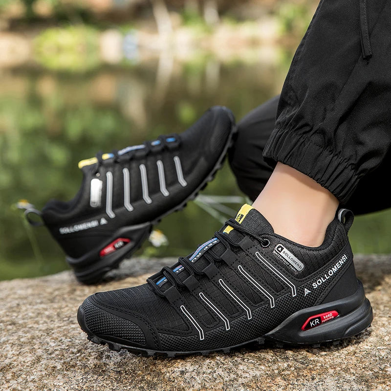Black hiking shoes with visible brand name on a blurred natural background