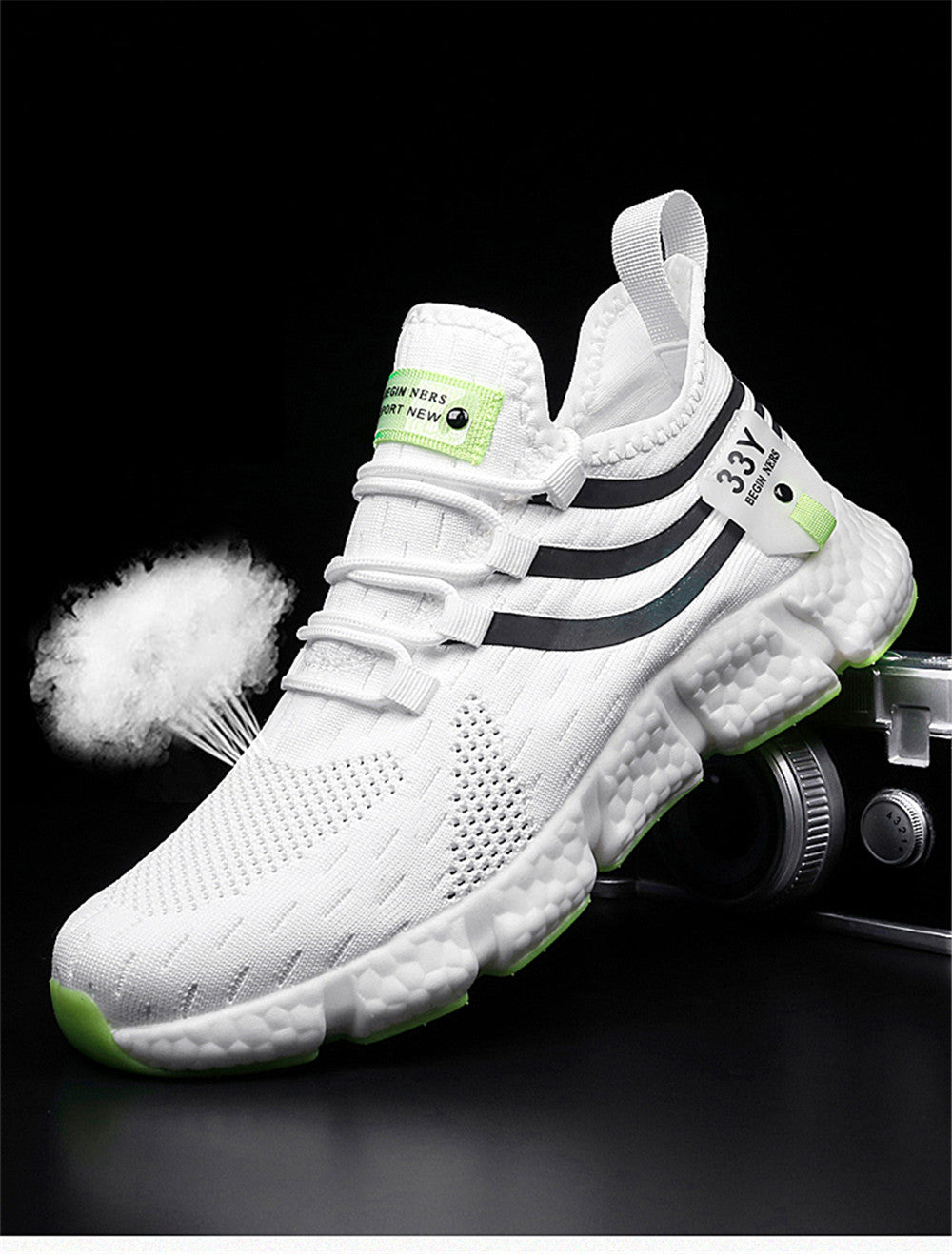 White sneaker with black stripes and green accents on a dark background