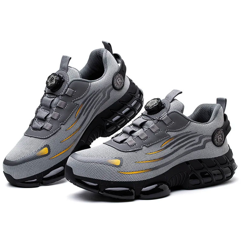 Gray and black athletic work shoes with yellow accents on a white background